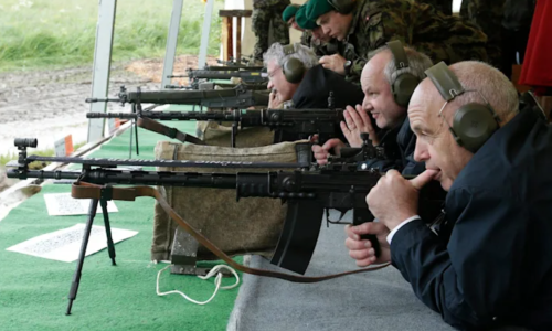 Swiss President Ueli Maurer pauses during a shooting-skills exercise — a several-hundred-year-old tradition — with the Foreign Diplomatic Corps in Switzerland on May 31, 2013.REUTERS/Denis Balibouse