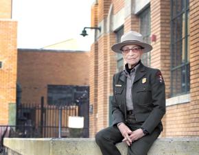 Ranger Betty Reid Soskin sits in front of the Rosie the Riveter Visitor Center. She is 96 years old. (Luther Bailey/NPS)