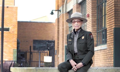 Ranger Betty Reid Soskin sits in front of the Rosie the Riveter Visitor Center. She is 96 years old. (Luther Bailey/NPS) Ranger Betty Reid Soskin sits in front of the Rosie the Riveter Visitor Center. She is 96 years old. (Luther Bailey/NPS)