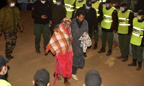 Rayan's parents leaving the scene after their son's body is taken away by ambulance - الصورة نقلا عن بي بي سي Rayan's parents leaving the scene after their son's body is taken away by ambulance - الصورة نقلا عن بي بي سي