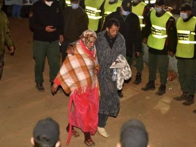 Rayan's parents leaving the scene after their son's body is taken away by ambulance - الصورة نقلا عن بي بي سي 